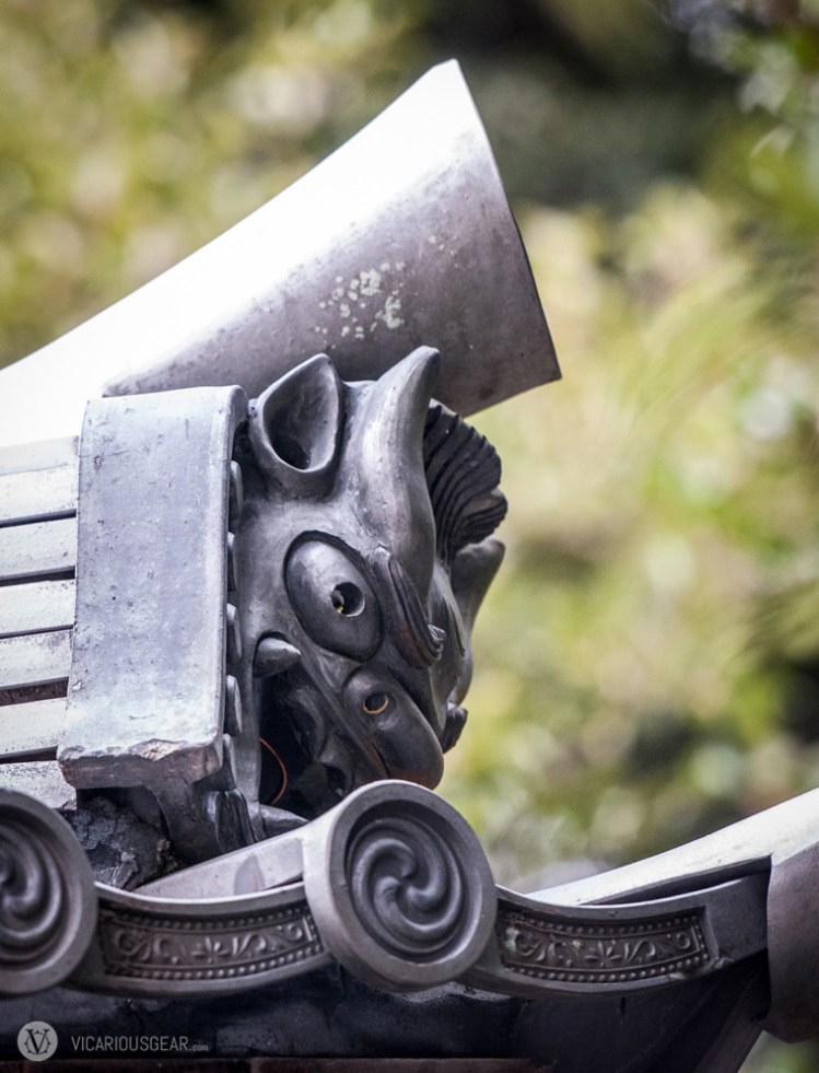 This small, animal like goblin tile hidden on the back side of a building.