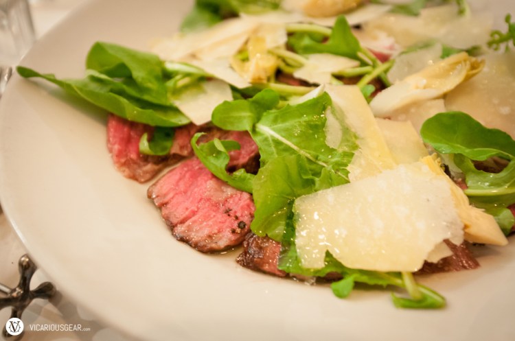 Chigasaki beef under a bed of arugula, heart of palm and parmesan 