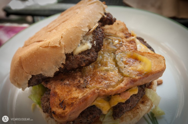 Hubcap Decker: Two fresh ground beef patties layered on toasted buns with American & Swiss cheese topped with lettuce, tomato, pickles, onions and special mayo sauce.