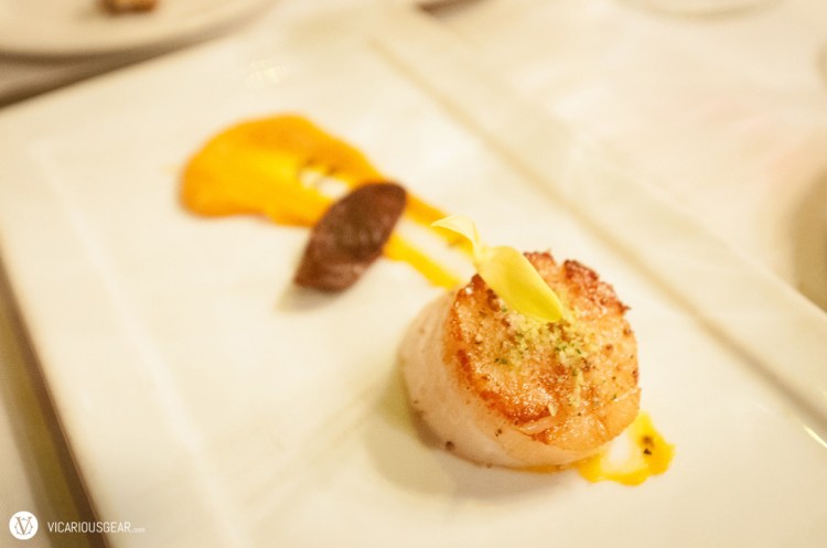 Seared diver scallop and andouille sausage.  Nicely seared for a great mix of textures once the scallop hits your tongue.