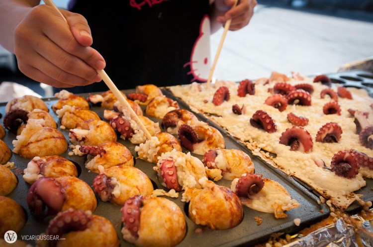Shortly after leaving the station and entering the main street for the festival, we found ourselves buying these たこ焼き (wheat-flour balls with octopus). Probably the best ones we have ever tried. They were using huge chunks of fresh octopus tentacles. 