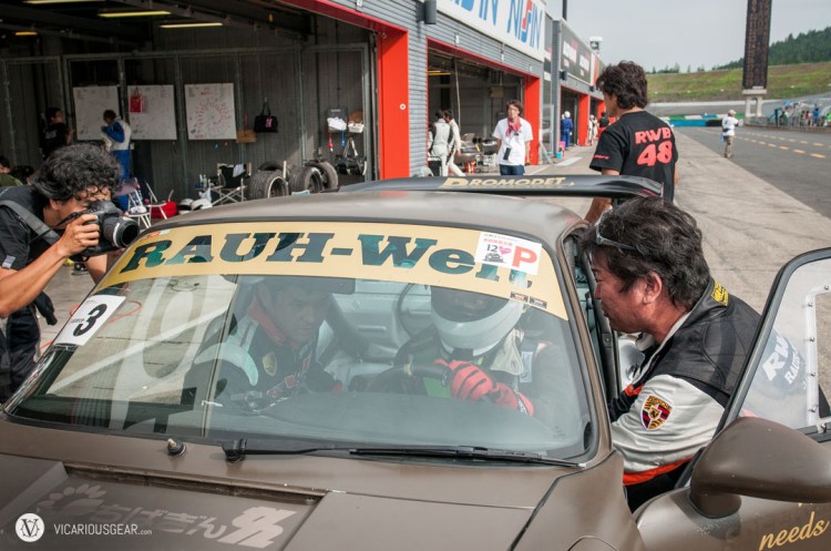 Getting strapped into the bucket seat.