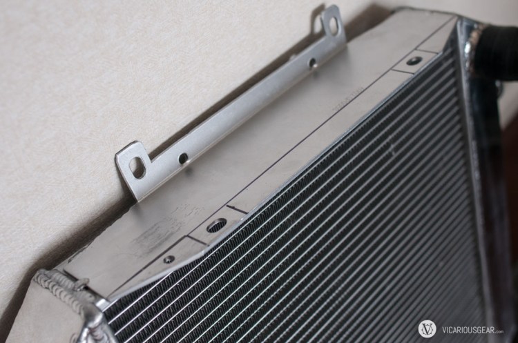 I purchased an aluminum radiator to replace the original copper item. The fan shroud tabs were in the wrong orientation so I had to do some fabrication.