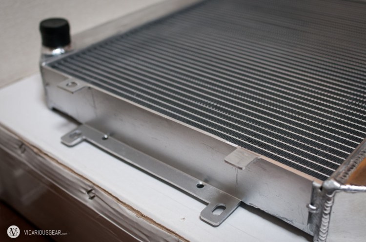 After marking the cuts and breaking out the jigsaw, I was able to bend the mounting tabs to accept a normal fan shroud.