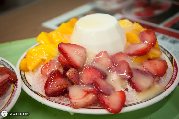 Mango, strawberry and milk pudding topped with condensed milk.