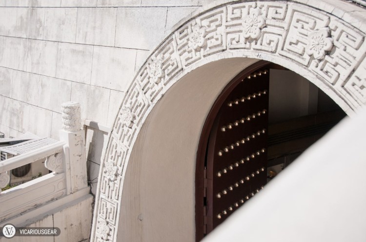 Large arched doors lead to a lower exhibition chamber.