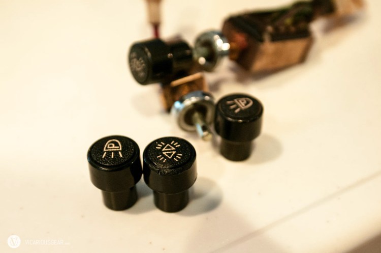 These two knobs are actually held in by a spring detent. Took me a while to figure out how to remove them since I was afraid to break one of the old switches.