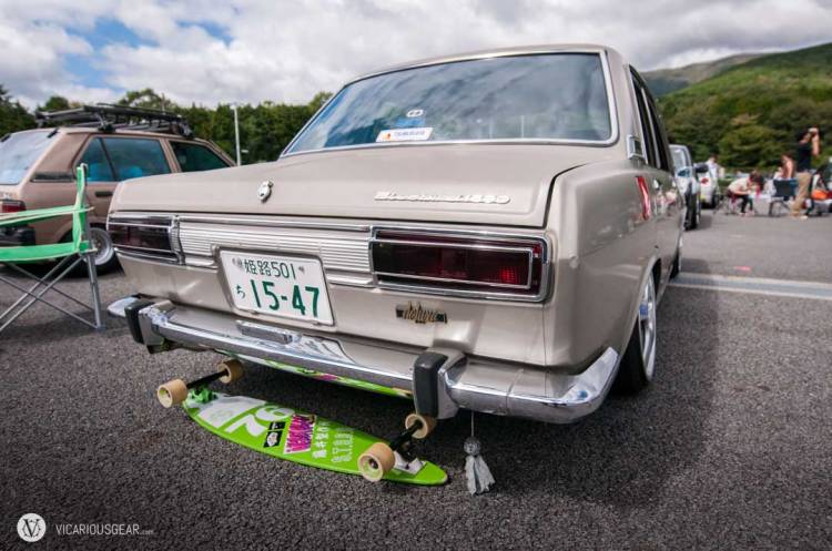 Fortunately the Teru teru bōzu ("Shine shine monk" to bring good weather) amulet hanging from this guys bumper worked a treat and made the clouds recede.