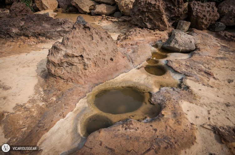 These pools of water had small boulders that broke off inside.