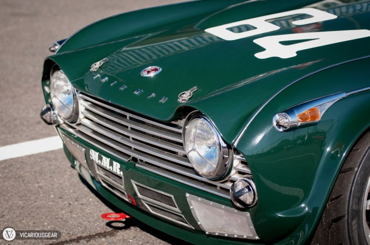 The smooth yet quirky hood details around the headlights on this immaculate Triumph TR4 looked pretty cool. It contrasted nicely with the rough bumper venting.