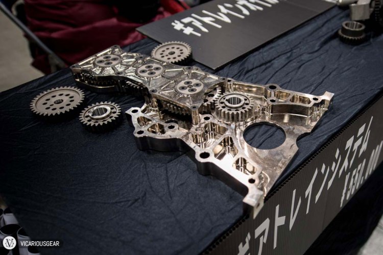 But reality hit me when I strolled past this vendor's parts display. The S20 chain to gear timing conversion was finished like the inside of a fine watch and with pricing to match (About 5,000 USD).