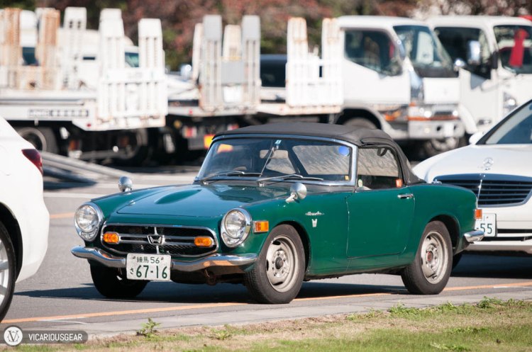 This Honda S800 chose to park amidst the largest cars and trucks it could find. 